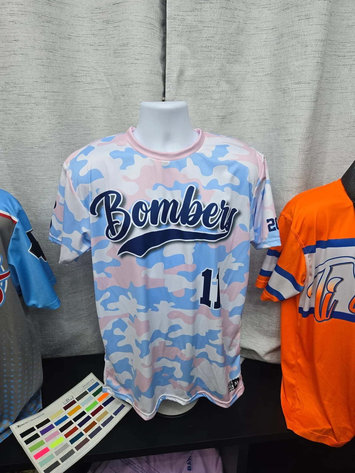 Custom camo baseball jersey photographed in the TiSports shop